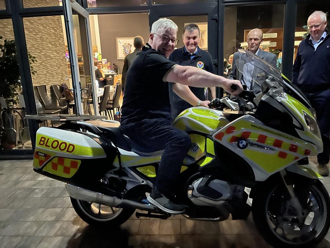 Members were given the opportunity to sit on the bike.  Here is Graham, watched by Phil (from Blood Bikes) on left, and Grant and Stephen